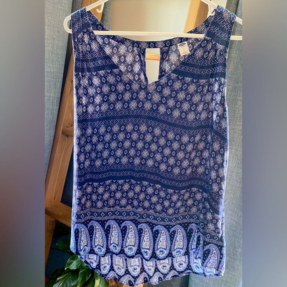 Blue paisley pattern sleeveless blouse.